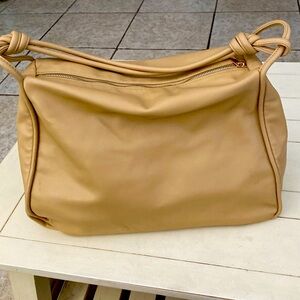 A New Day carryall. Non leather material.